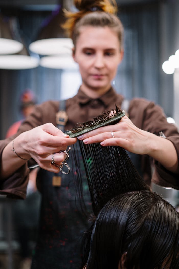 woman getting a haircut 3993443